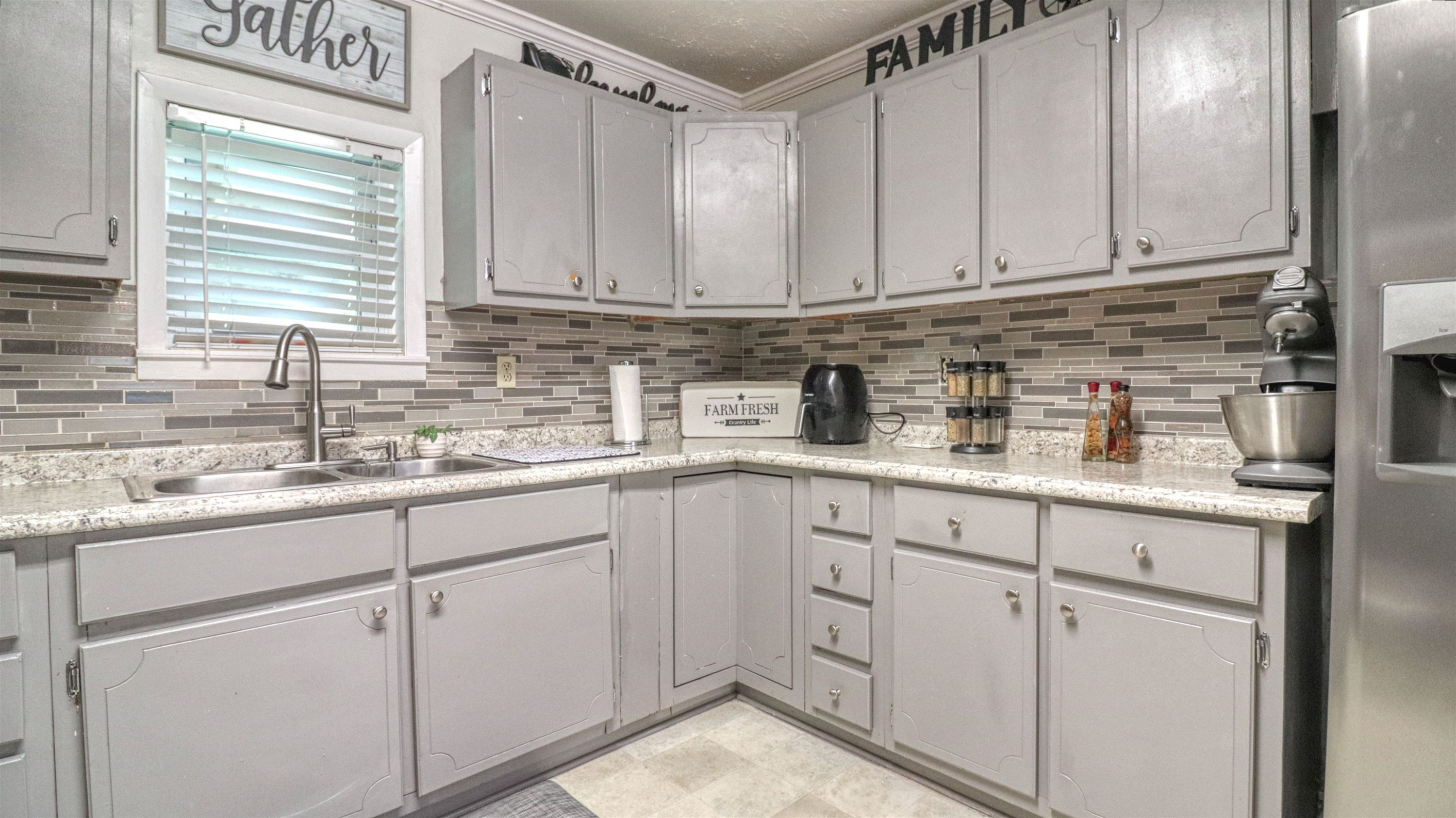 390 Lowery Road Medon, TN 38356 - Photo 11 of 24 a kitchen with sink cabinets and window