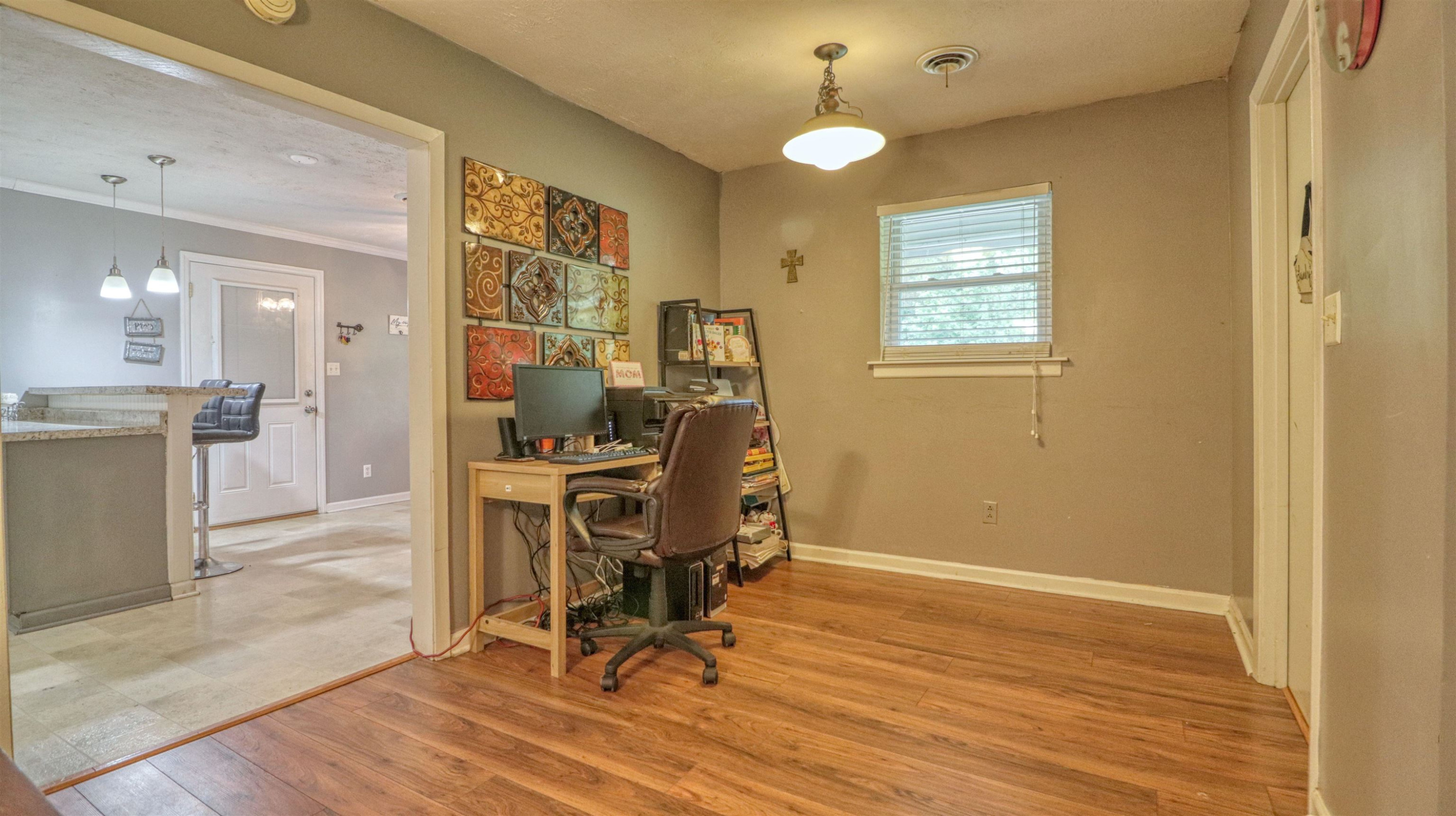 390 Lowery Road Medon, TN 38356 - Photo 14 of 24 a view of a workspace with furniture and a window