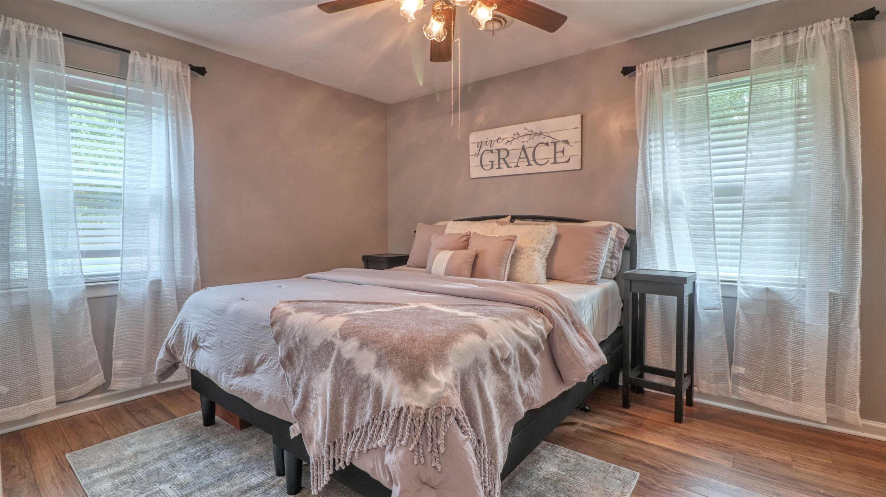 390 Lowery Road Medon, TN 38356 - Photo 16 of 24 a bedroom with a bed and a chandelier