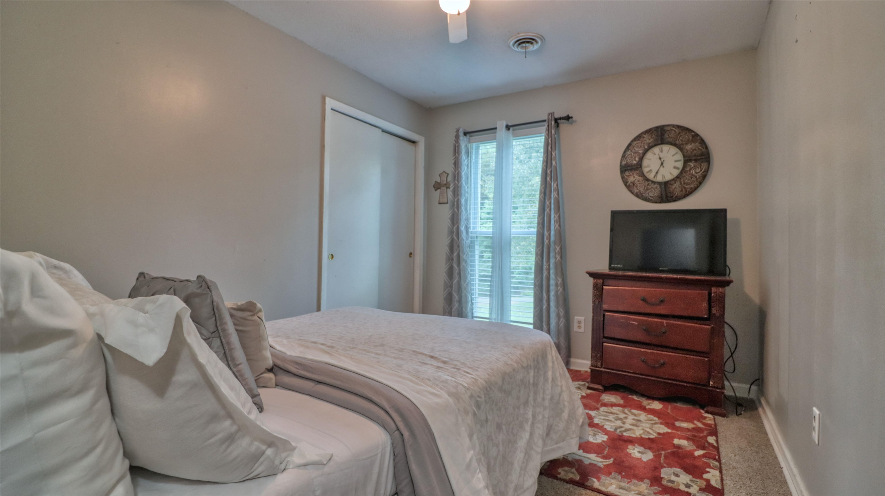 390 Lowery Road Medon, TN 38356 - Photo 18 of 24 a bedroom with a bed and a television in it