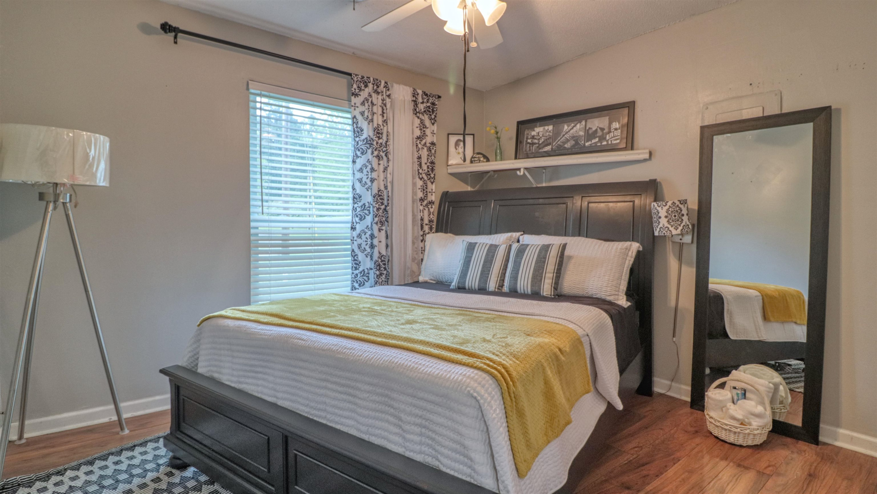 390 Lowery Road Medon, TN 38356 - Photo 19 of 24 a bedroom with a bed and wooden floor
