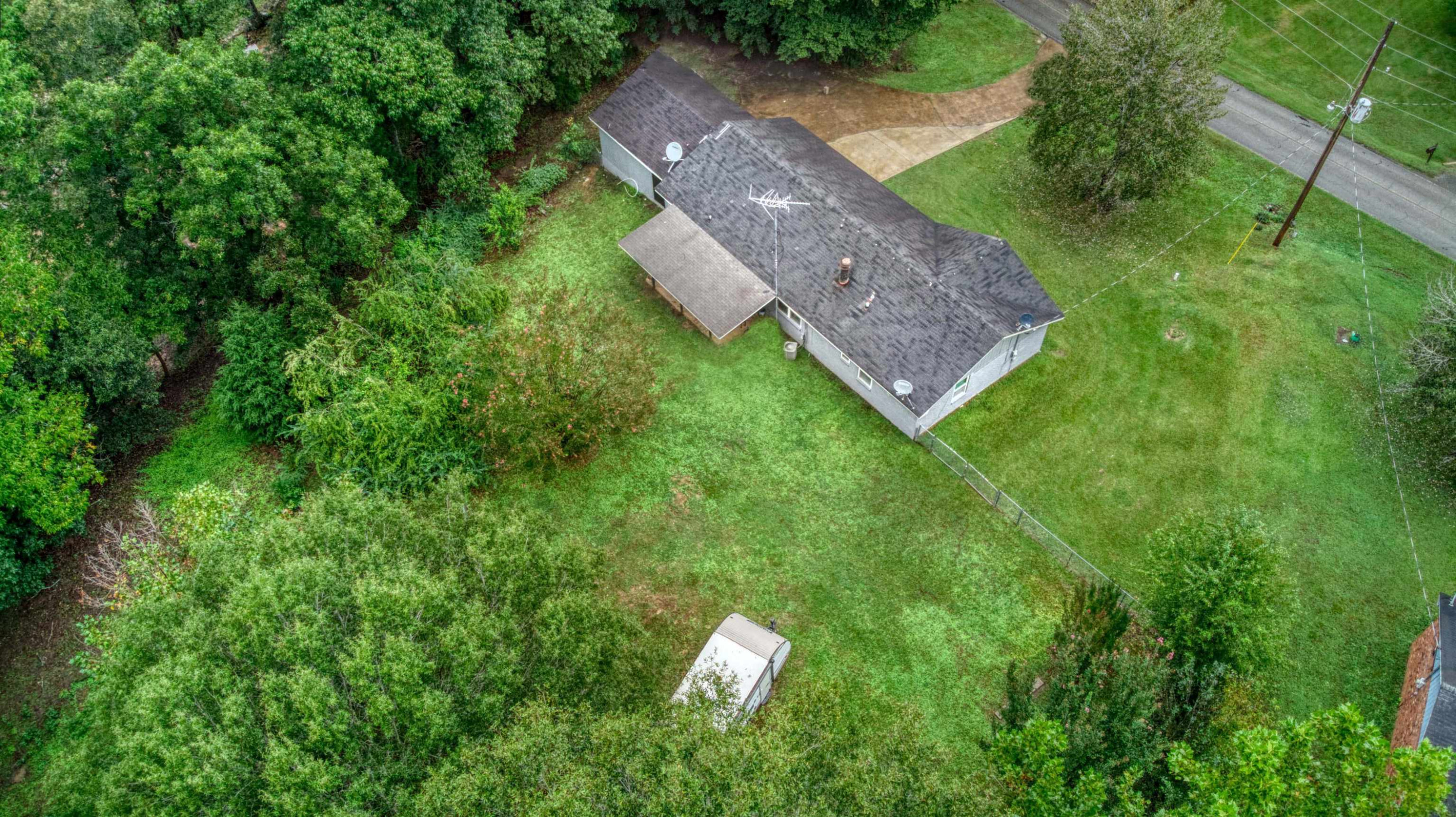 390 Lowery Road Medon, TN 38356 - Photo 2 of 24 a aerial view of a house with a yard large tree and a yard