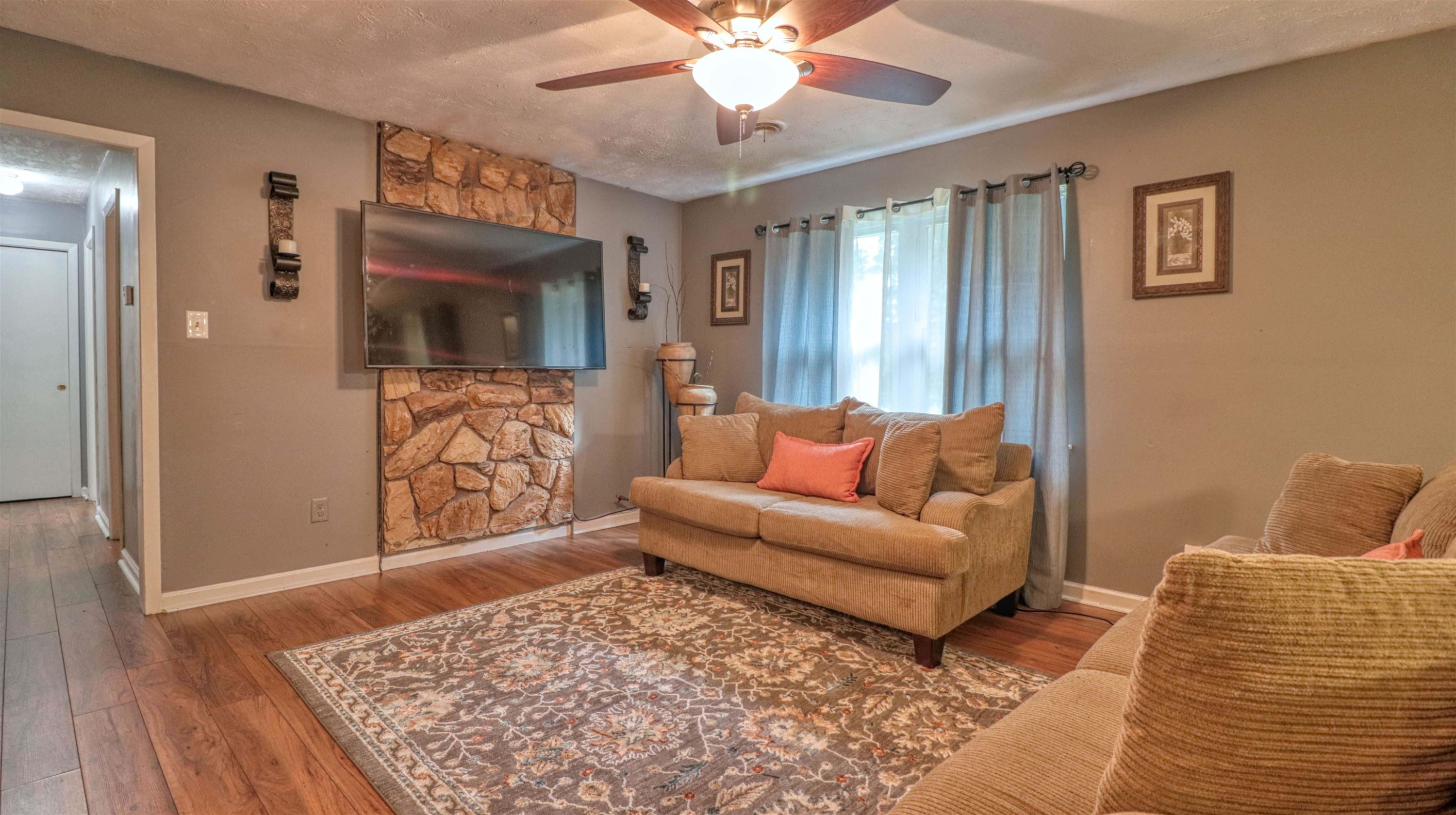 390 Lowery Road Medon, TN 38356 - Photo 3 of 24 a living room with furniture and a flat screen tv