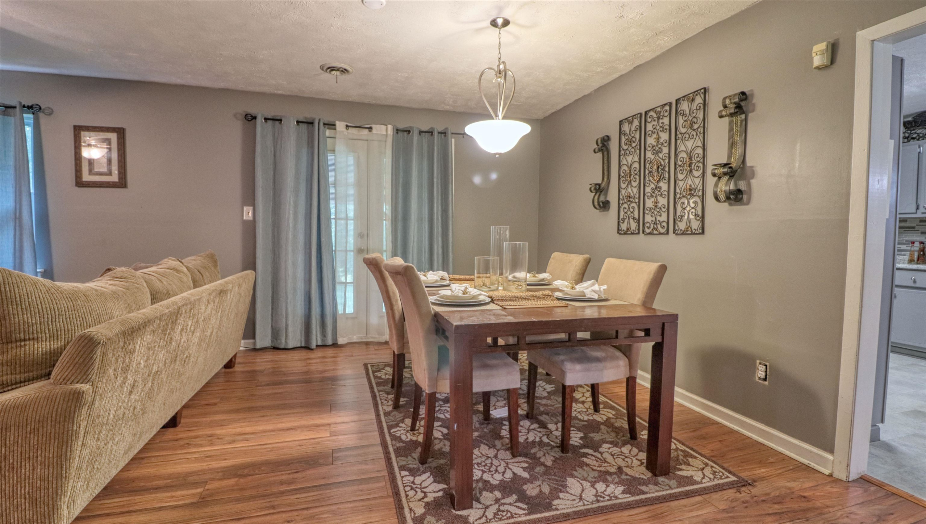 390 Lowery Road Medon, TN 38356 - Photo 6 of 24 a view of a dining room with furniture and wooden floor