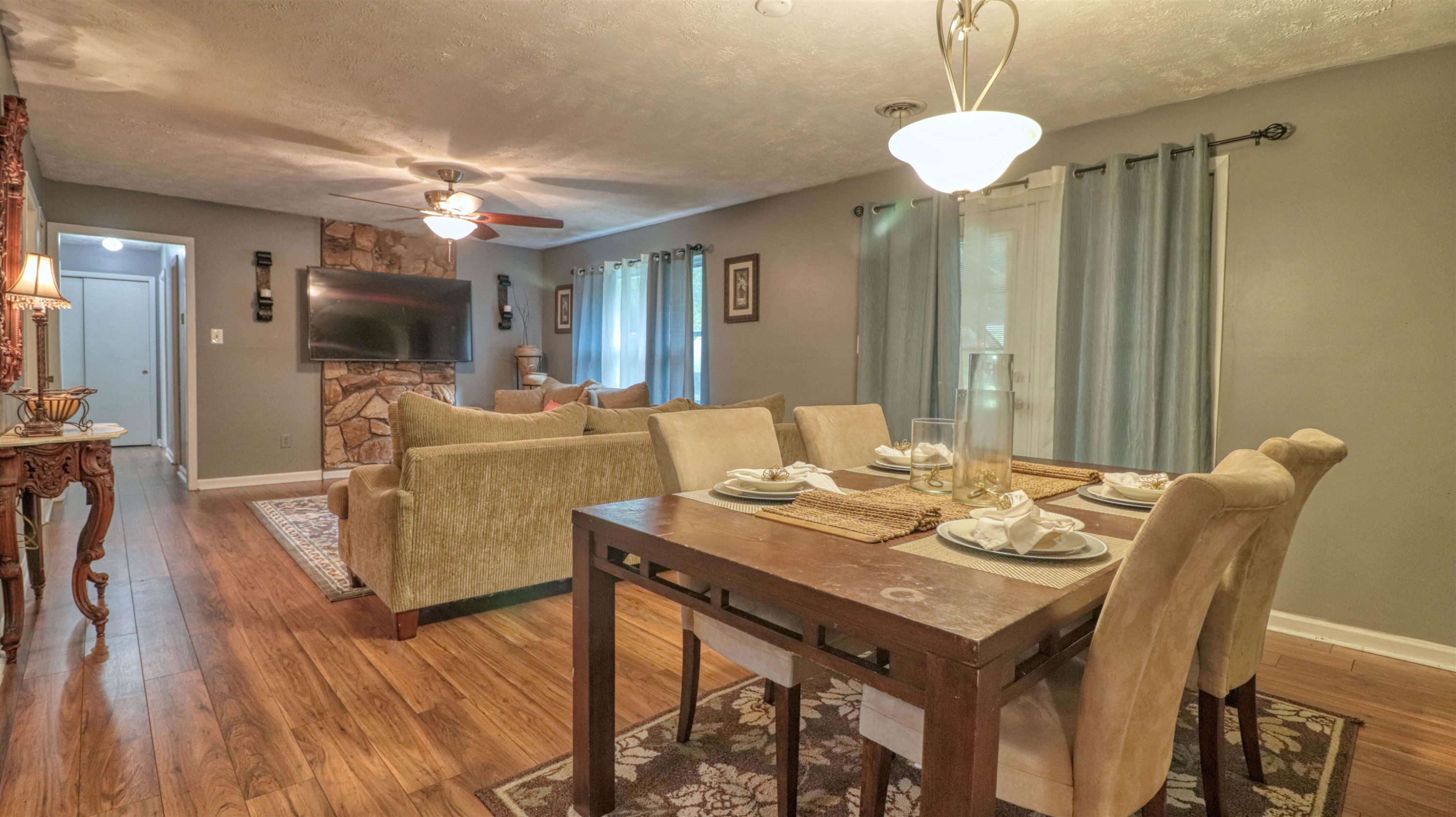 390 Lowery Road Medon, TN 38356 - Photo 7 of 24 a view of a dining room with furniture wooden floor and chandelier