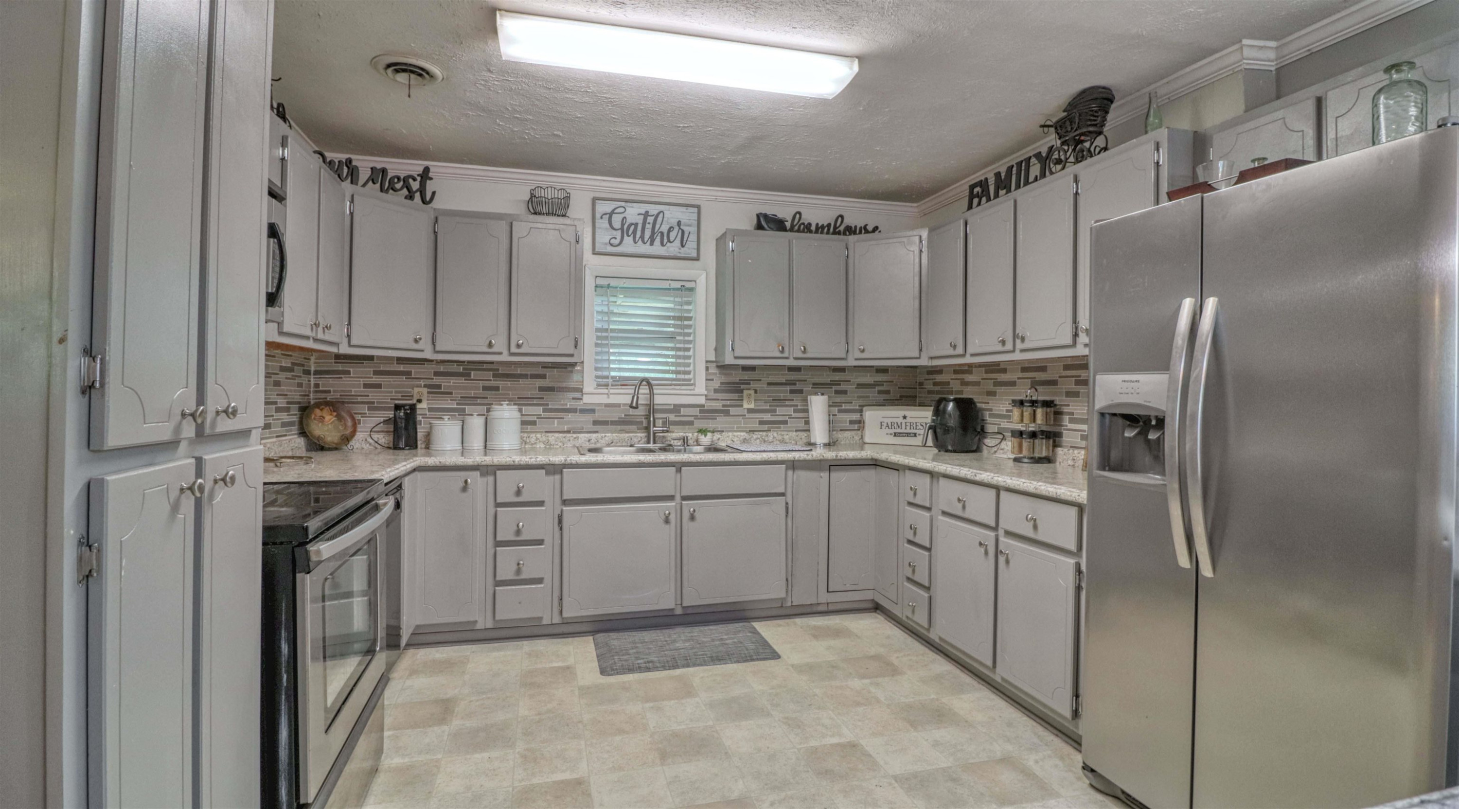 390 Lowery Road Medon, TN 38356 - Photo 8 of 24 a kitchen with cabinets appliances a sink and a window