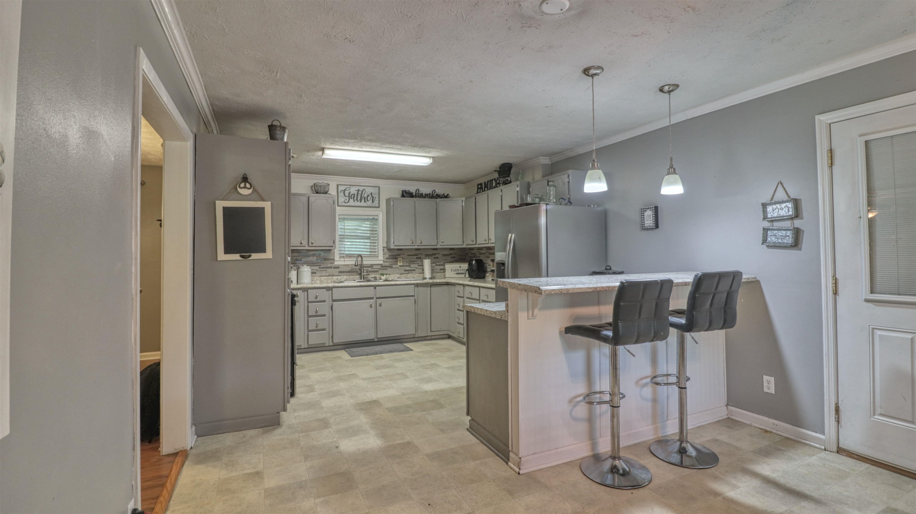 390 Lowery Road Medon, TN 38356 - Photo 10 of 24 a kitchen with a refrigerator and a sink
