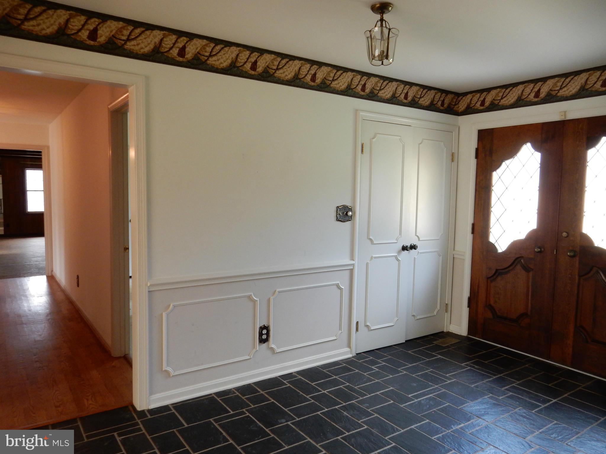 Foyer with hallway looking into Family Room