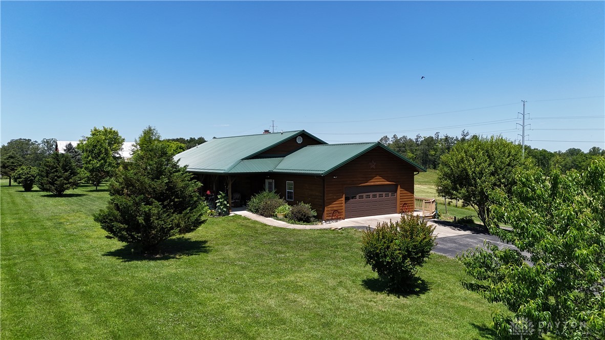 This charming home offers a spacious yard and inviting curb appeal.