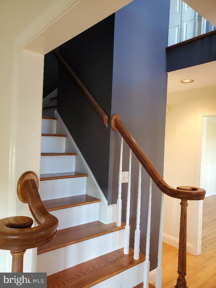 9368 Clendaniel Pond Road Lincoln, DE 19960 - Photo 39 of 58 Winding stair case with balcony over looking foyer