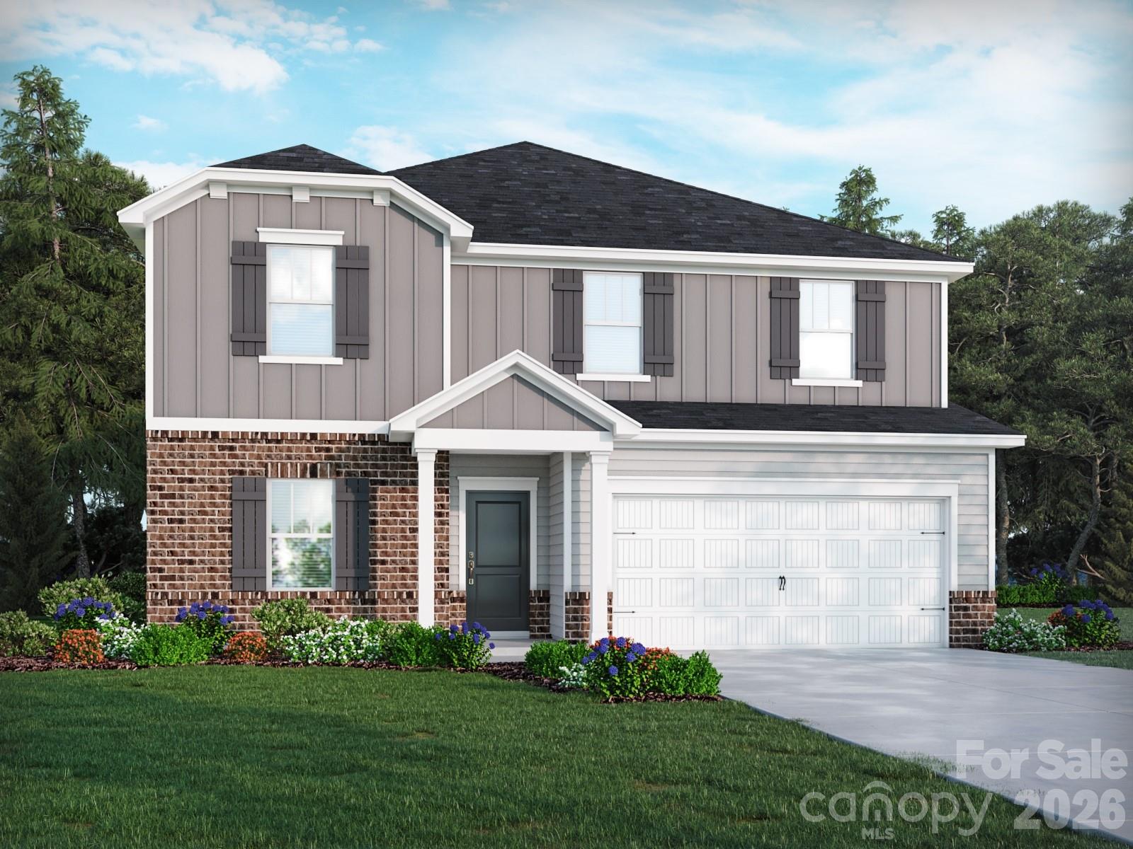 2440 Chartwell Street Stanley, NC 28164 - Photo 1 of 17 a front view of a house with a garden and plants