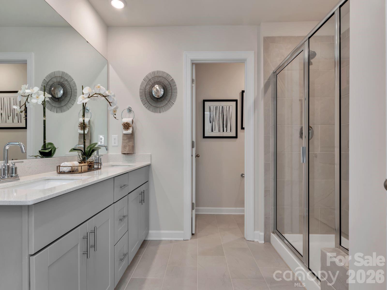 2440 Chartwell Street Stanley, NC 28164 - Photo 11 of 17 a bathroom with a double vanity sink and a mirror