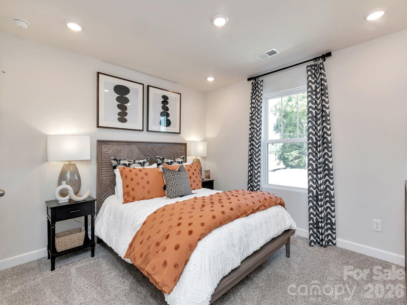 2440 Chartwell Street Stanley, NC 28164 - Photo 12 of 17 a bedroom with a bed and a window