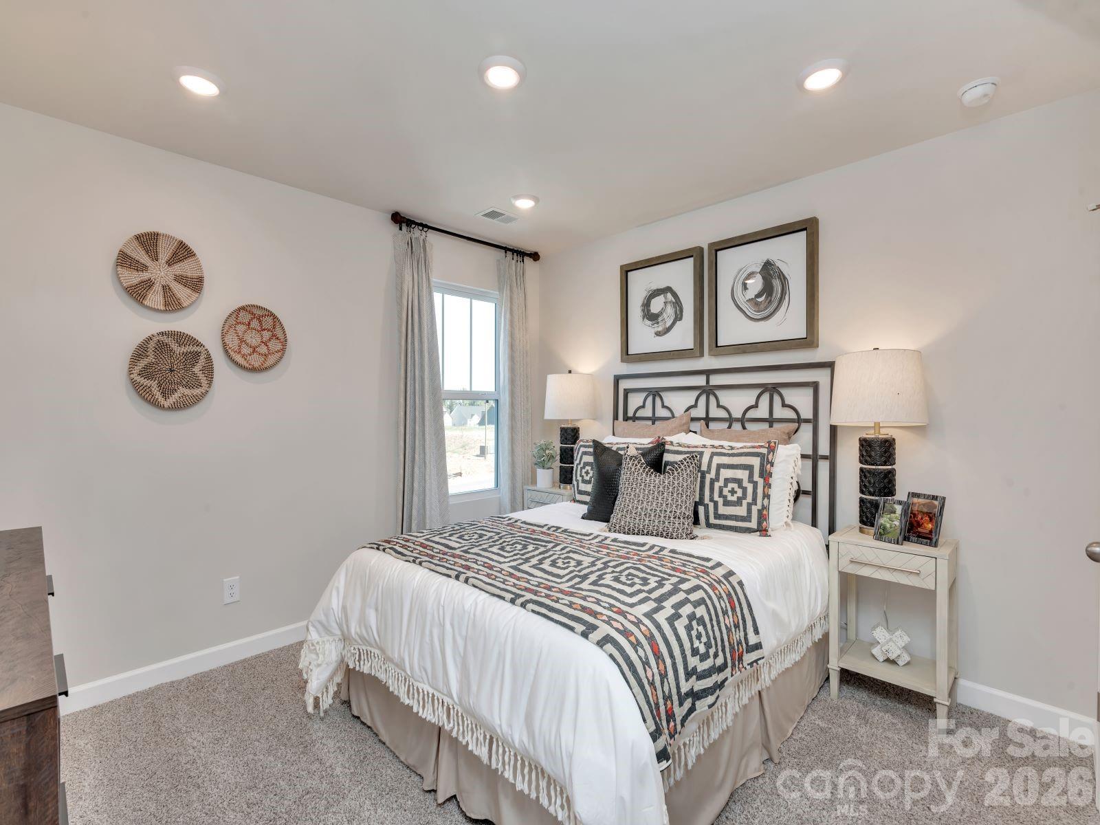 2440 Chartwell Street Stanley, NC 28164 - Photo 14 of 17 a bedroom with a bed and a window