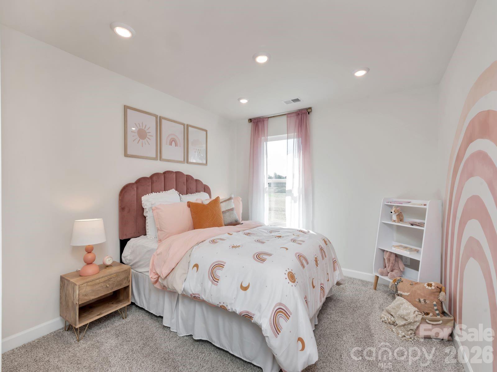 2440 Chartwell Street Stanley, NC 28164 - Photo 15 of 17 a bedroom with a bed and a cabinets