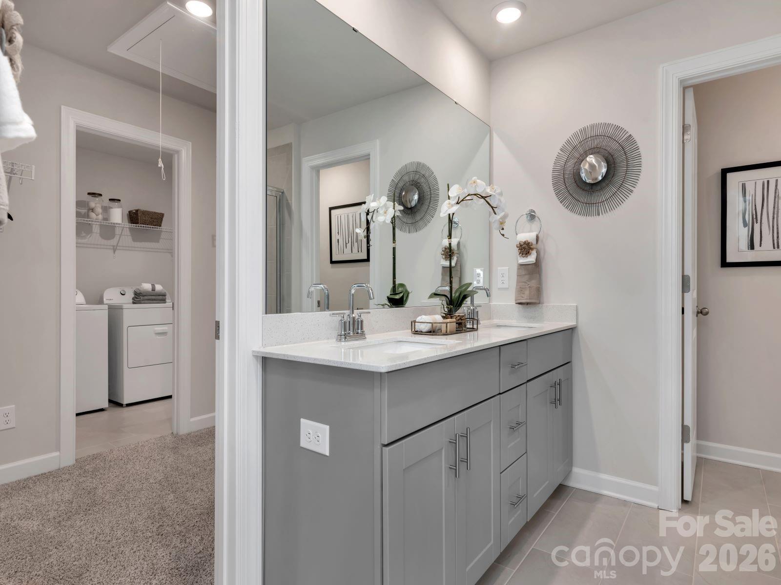 2440 Chartwell Street Stanley, NC 28164 - Photo 16 of 17 a bathroom with a double vanity sink and a mirror