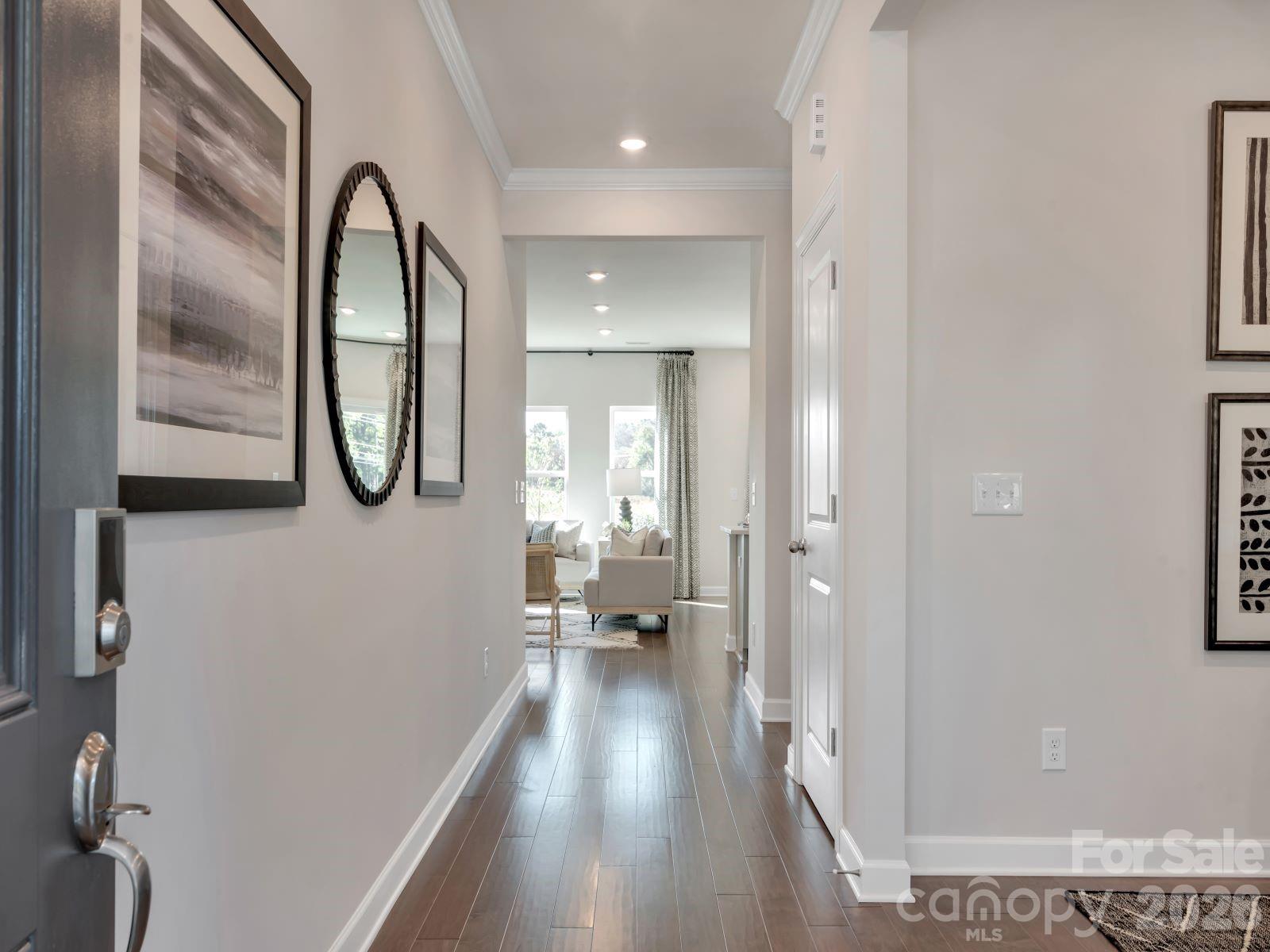 2440 Chartwell Street Stanley, NC 28164 - Photo 3 of 17 a view of a room with wooden floor and furniture