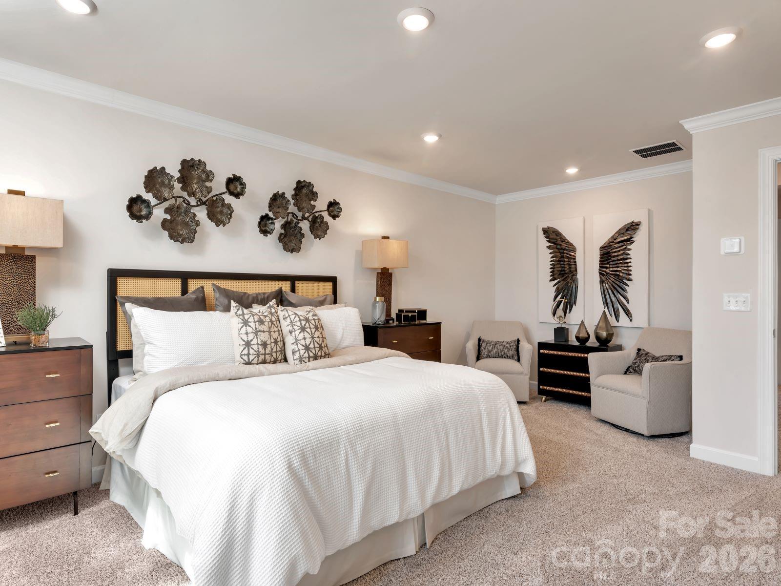 2440 Chartwell Street Stanley, NC 28164 - Photo 10 of 17 a bedroom with a large bed and a couch