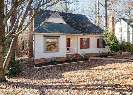 5608 Chatmoss Road Midlothian, VA 23112 - Photo 3 of 16 a front view of a house with trees