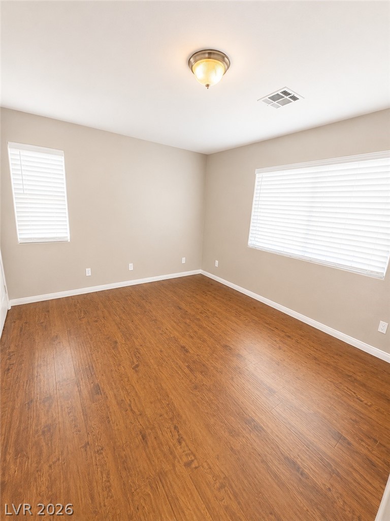 7213 London Bridge Avenue Las Vegas, NV 89130 - Photo 3 of 11 This airy room features durable wood-look flooring and ample natural light.