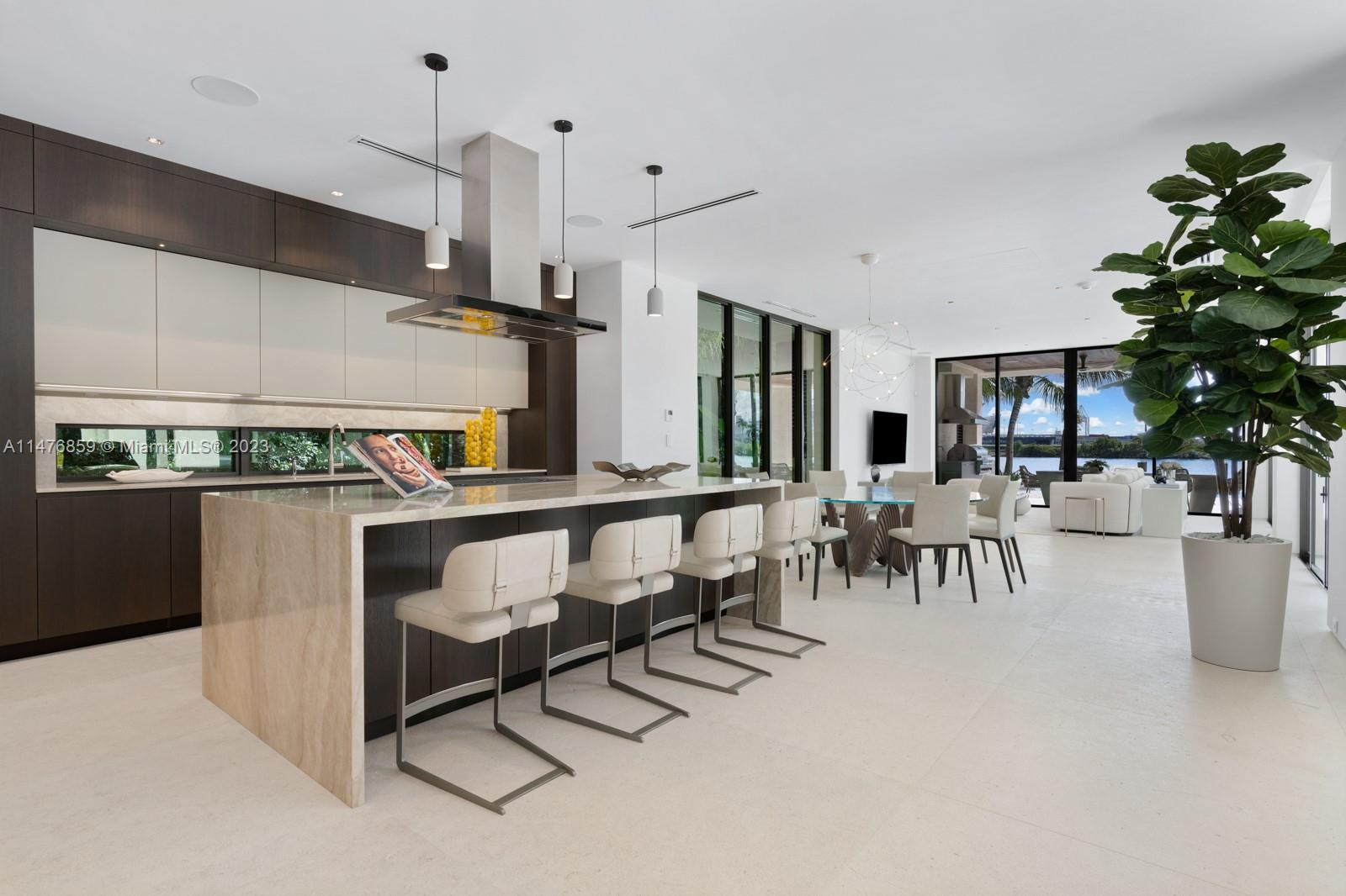 40 Palm Avenue Miami Beach, FL 33139 - Photo 13 of 62 a group of chairs sitting in kitchen and dining room