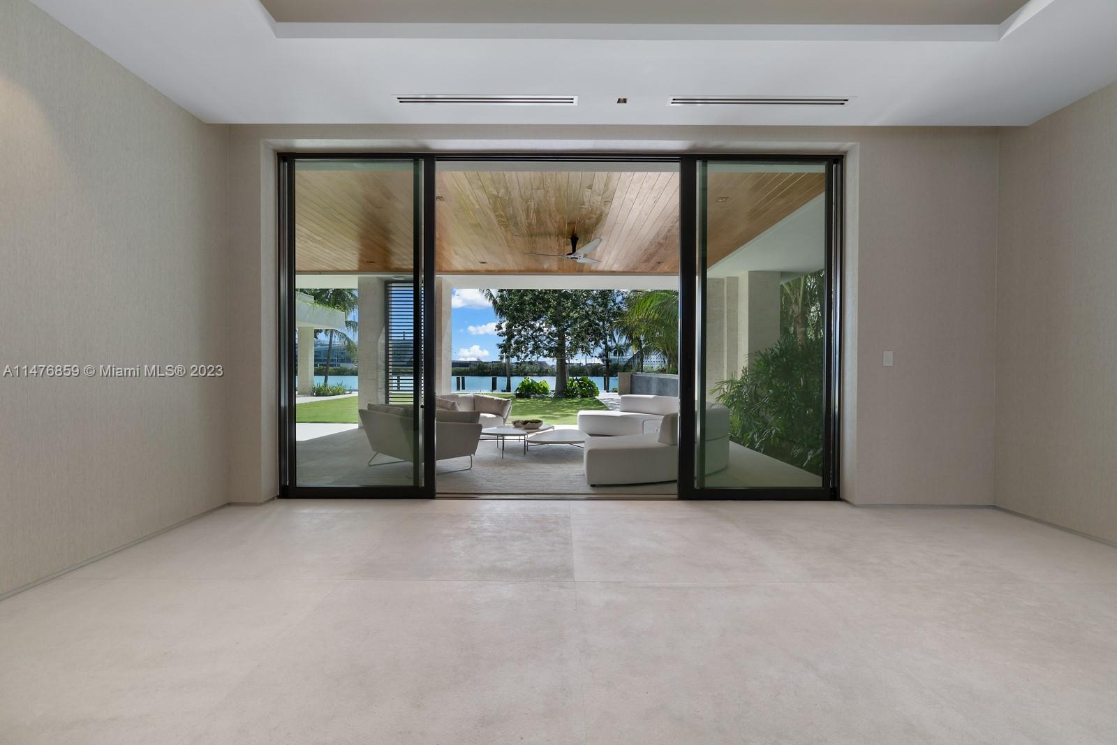 40 Palm Avenue Miami Beach, FL 33139 - Photo 20 of 62 a view of an empty room with large windows and a balcony