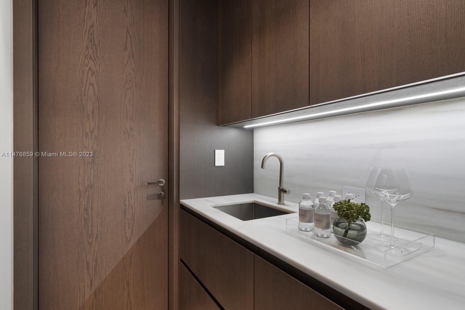 40 Palm Avenue Miami Beach, FL 33139 - Photo 34 of 62 a kitchen with a sink and potted plant