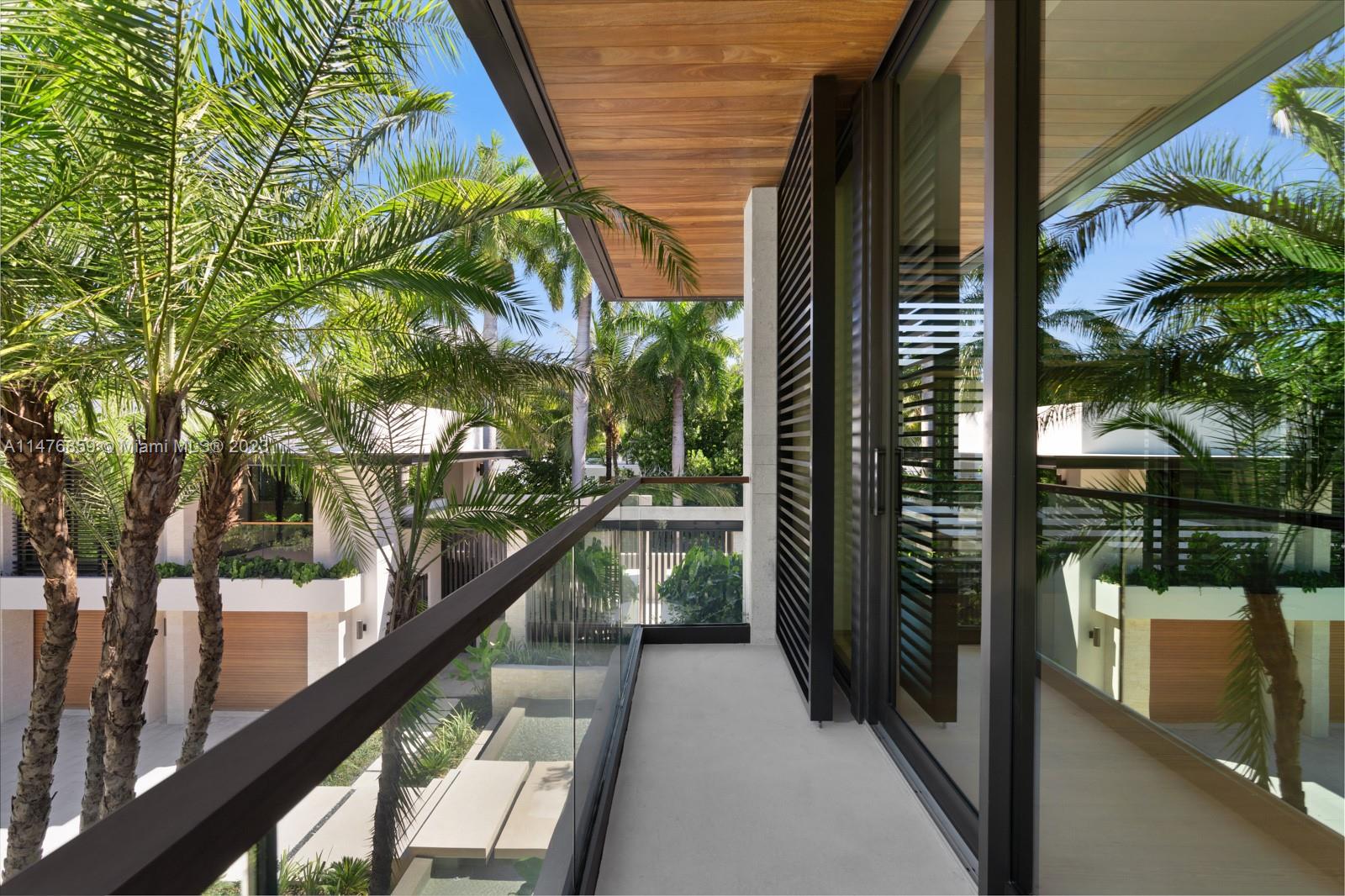 40 Palm Avenue Miami Beach, FL 33139 - Photo 42 of 62 a view of balcony with wooden floor and fence