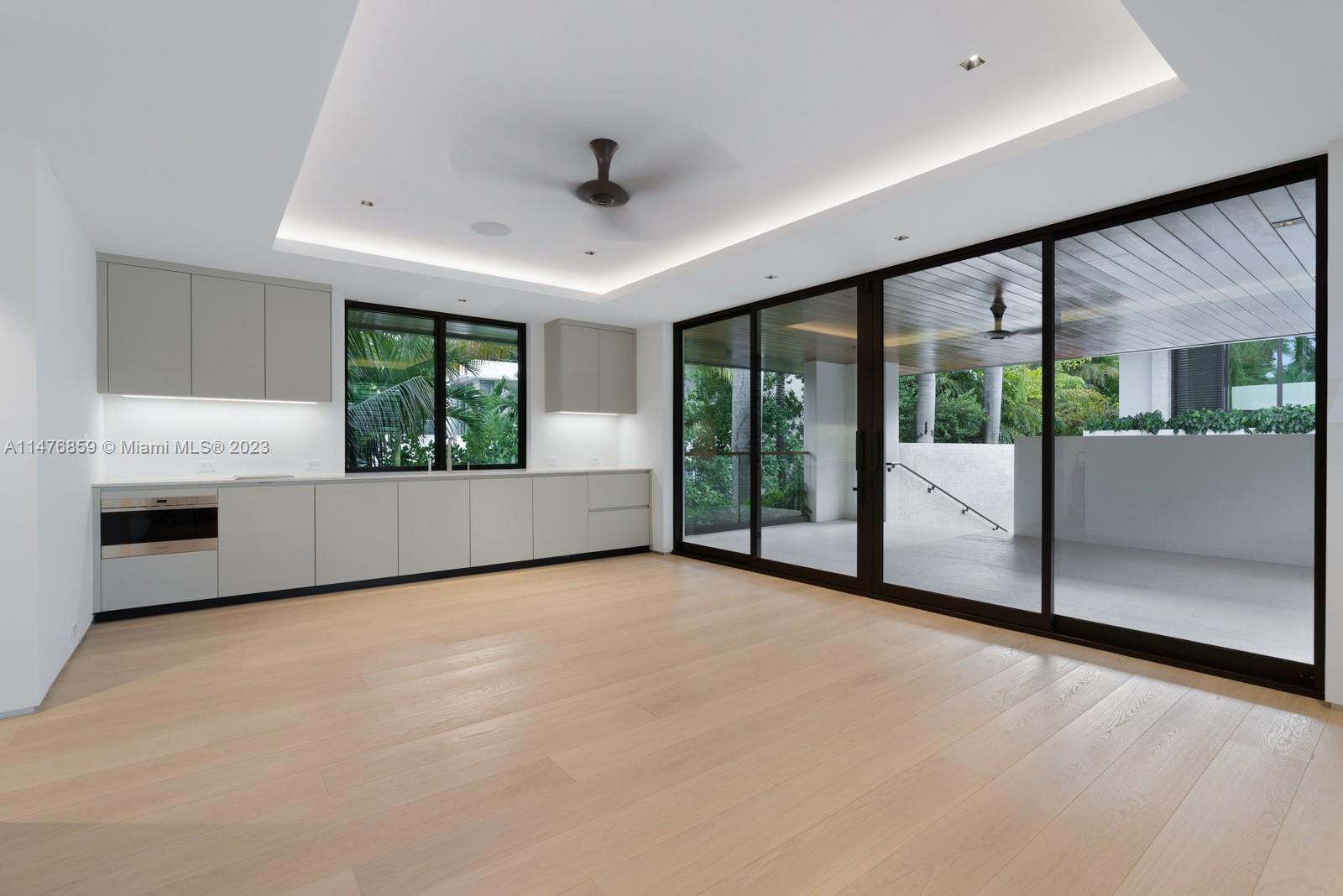 40 Palm Avenue Miami Beach, FL 33139 - Photo 50 of 62 a view of an empty room with a fireplace and a large window