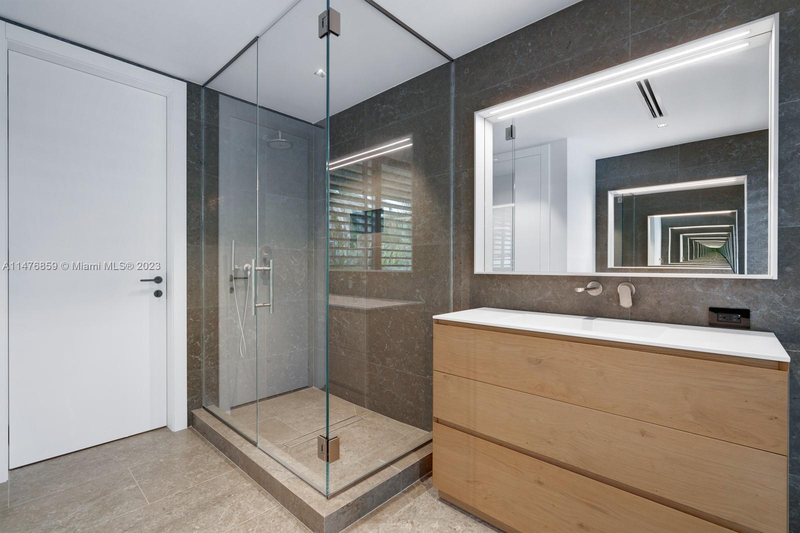 40 Palm Avenue Miami Beach, FL 33139 - Photo 52 of 62 a bathroom with a sink and a mirror