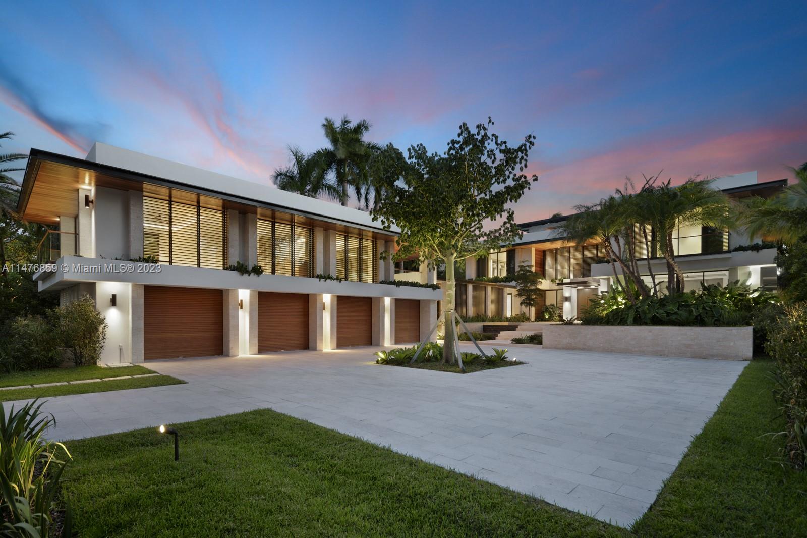 40 Palm Avenue Miami Beach, FL 33139 - Photo 55 of 62 a front view of a house with a yard and potted plants
