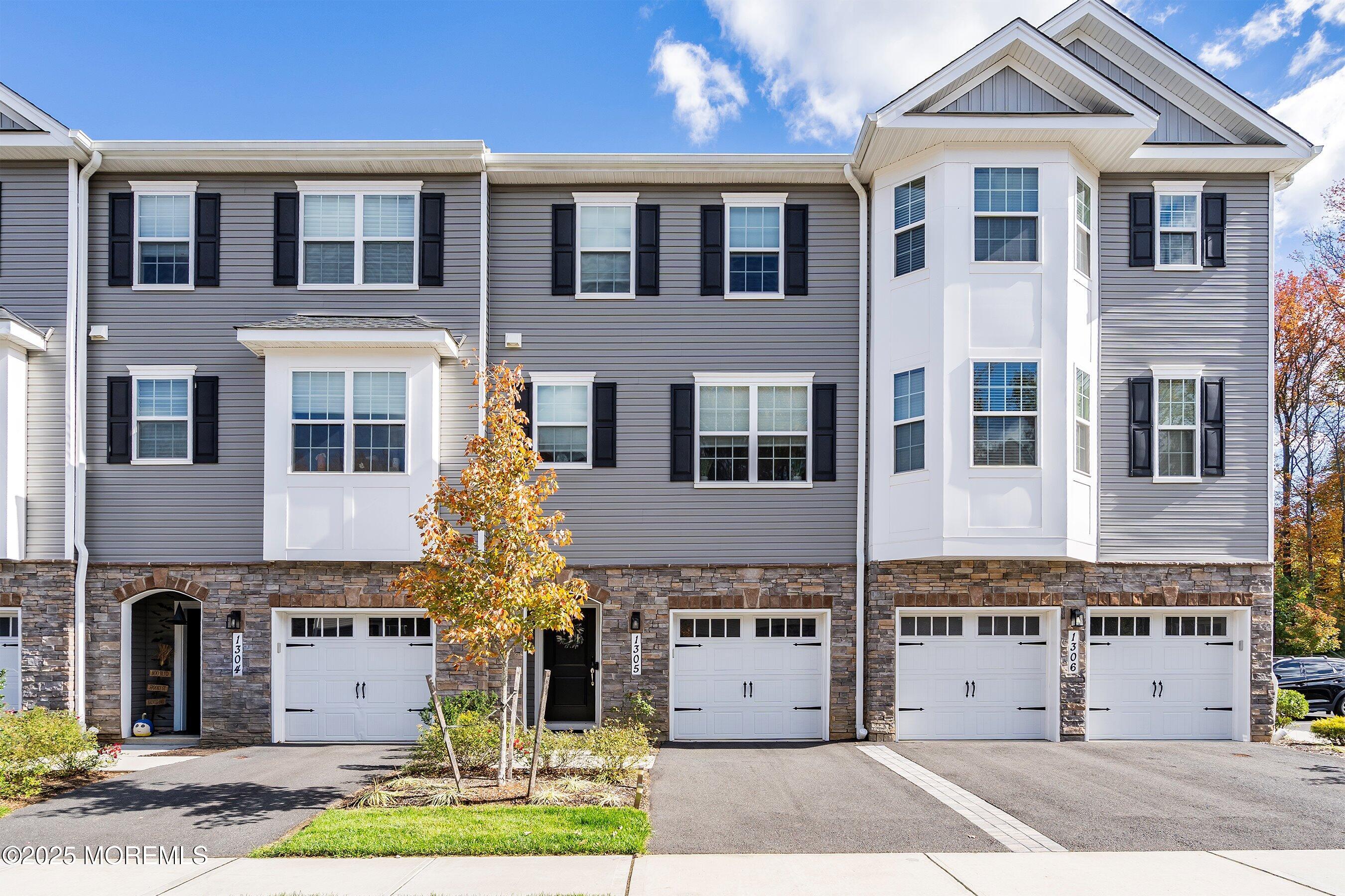 a front view of a building with parking space