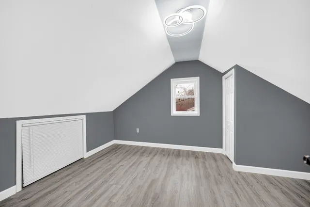 a bathroom with a bathtub a sink and a mirror