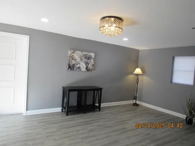 a view of a livingroom with wooden floor