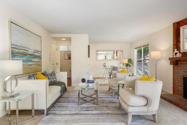 a living room with furniture and a table