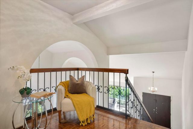 a view of a balcony with chairs