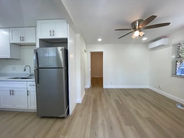a kitchen with a refrigerator a sink and dishwasher
