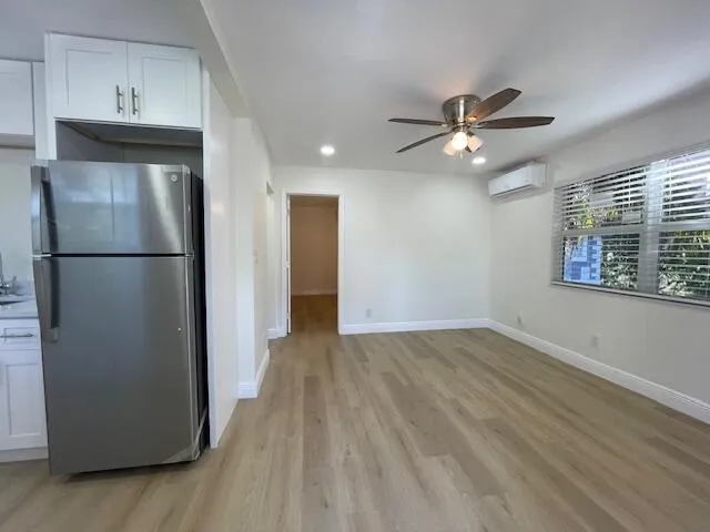a view of a kitchen with closet and a ceiling fan