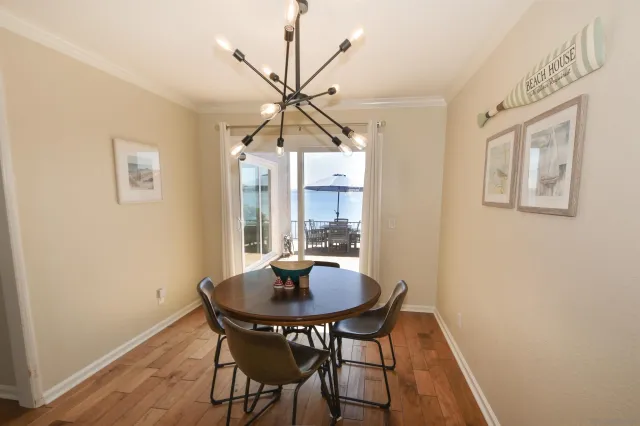 a view of a dining room with furniture and window