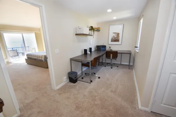 a workspace with furniture and a window