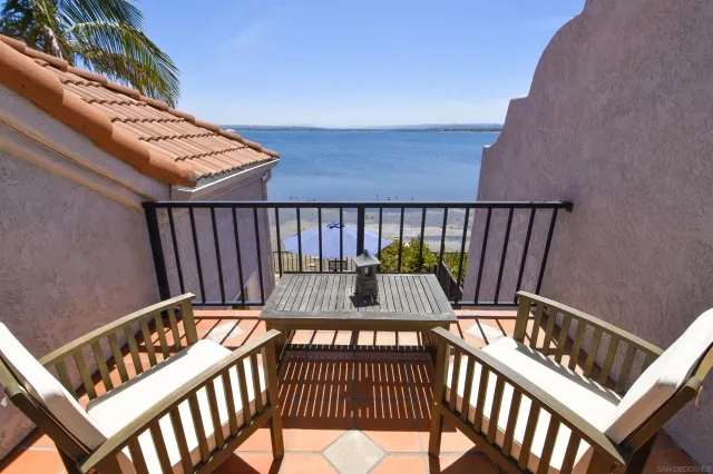 a view of balcony with wooden floor