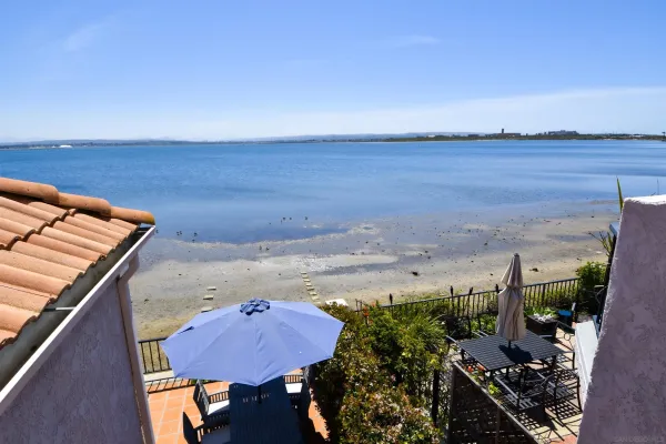a view of a two chairs in the balcony