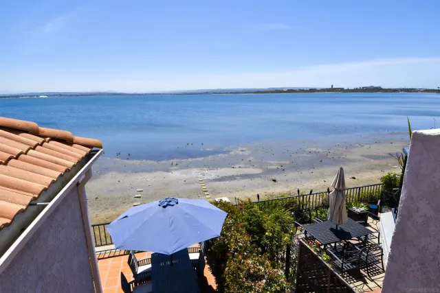 a view of a two chairs in the balcony