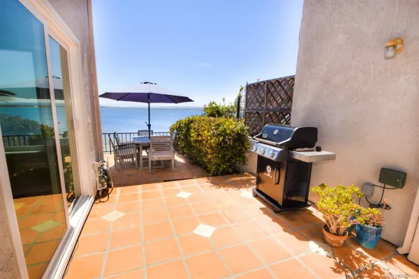 a view of a dinning table and chairs in the patio