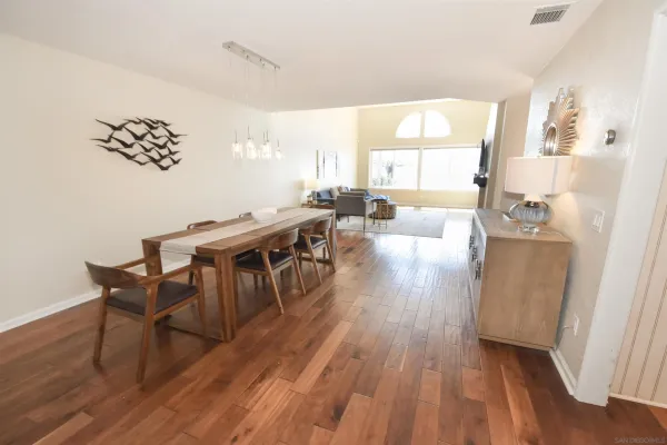 a view of a dining room with furniture window and wooden floor