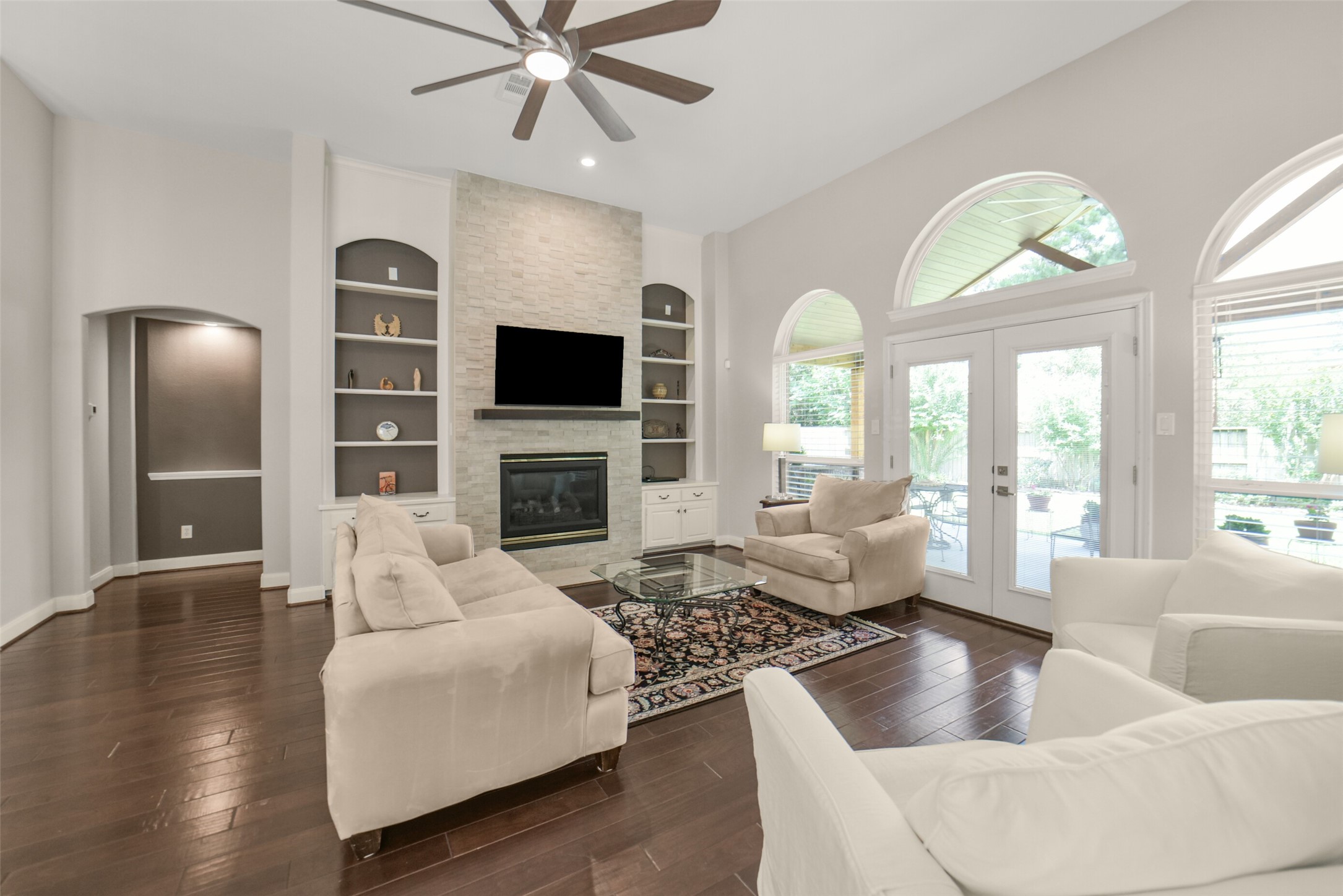 1310 Lambourne Circle Spring, TX 77379 - Photo 19 of 50 Family room with redesigned fireplace area, new mantel, marble stack stone and private entrance to the main bedroom