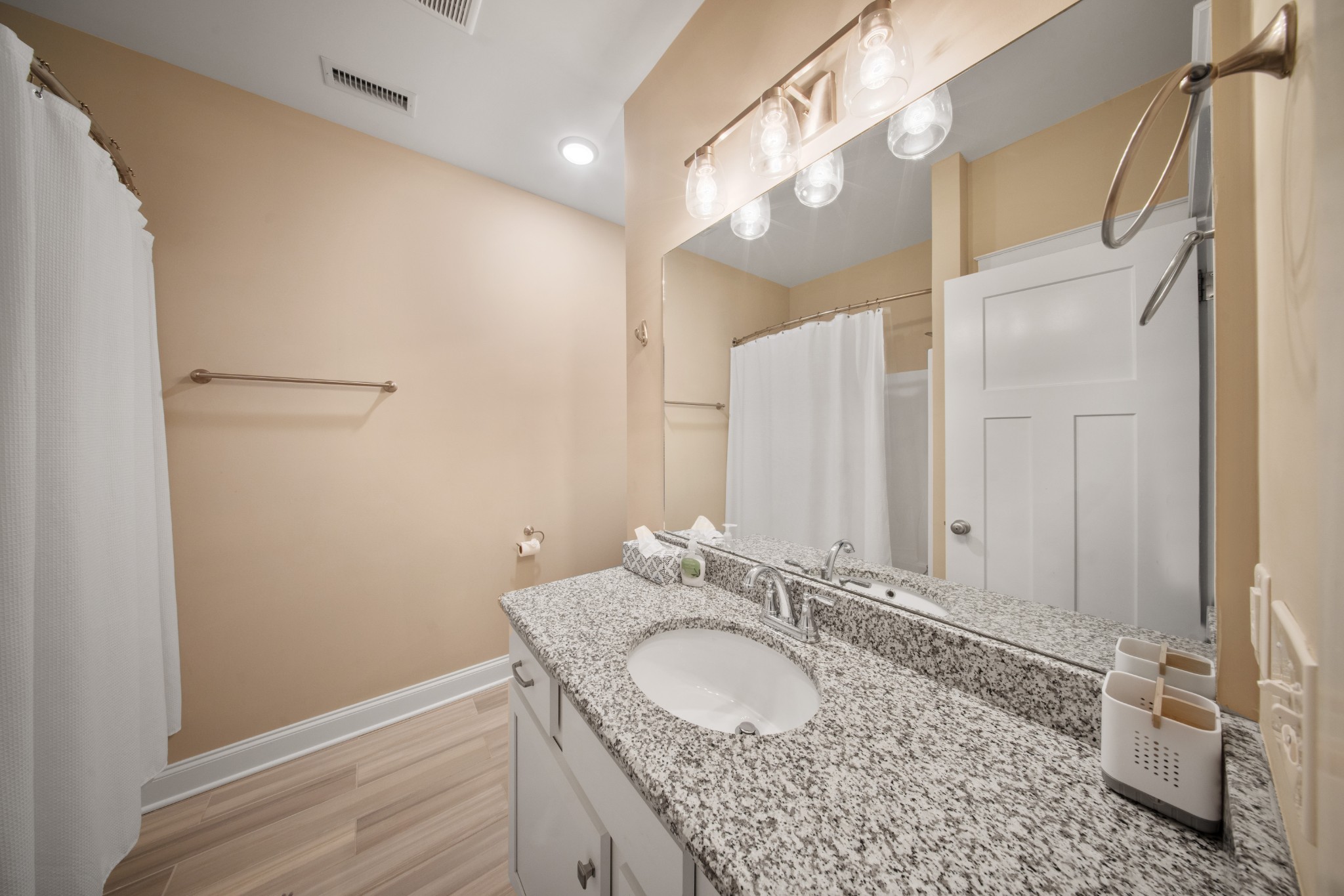 1019 North Maple Street, Unit 2B Murfreesboro, TN 37130 - Photo 17 of 26 a bathroom with a granite countertop sink and a mirror