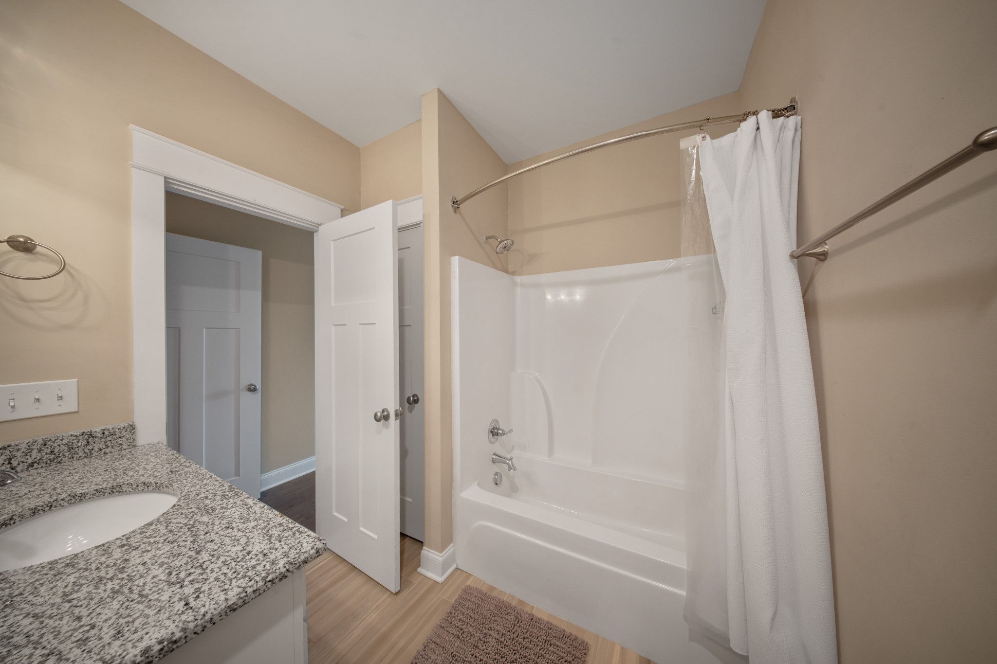 1019 North Maple Street, Unit 2B Murfreesboro, TN 37130 - Photo 19 of 26 a bathroom with a granite countertop sink and shower
