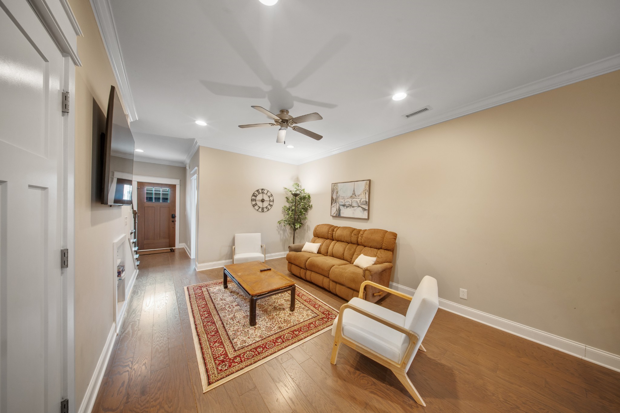 1019 North Maple Street, Unit 2B Murfreesboro, TN 37130 - Photo 2 of 26 a living room with furniture and a chandelier
