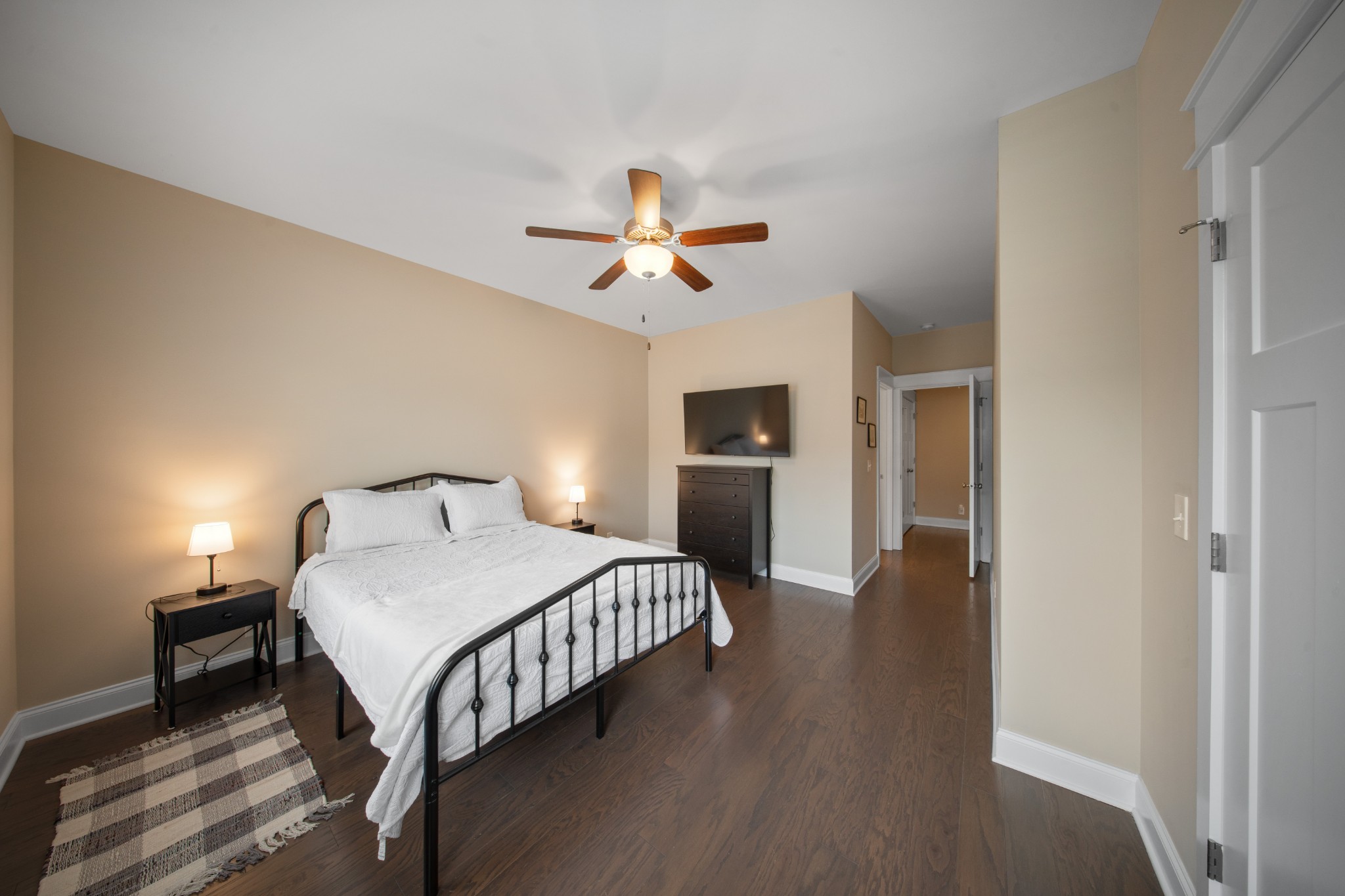 1019 North Maple Street, Unit 2B Murfreesboro, TN 37130 - Photo 21 of 26 a bedroom with a bed and a ceiling fan